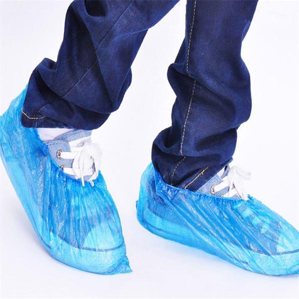 Disposable shoe covers on shoes