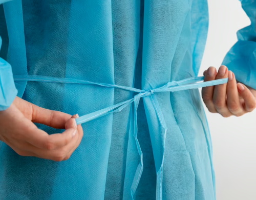Doctor is wearing isolation gown